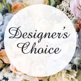 Round sign reading "Designer's Choice" over pastel flowers