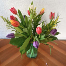 Colorful tulips arranged in a glass vase