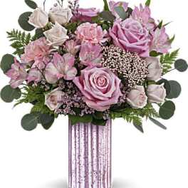 Pink roses and alstroemeria in a striped vase
