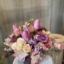 Pink and lavender bouquet in a glittery vase