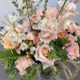 Pastel bouquet of roses, gerbera daisies, and mixed blooms