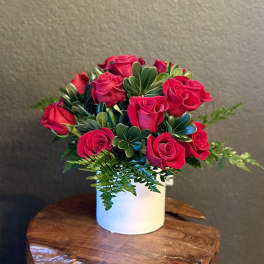 Bouquet of hot pink roses in a white vase