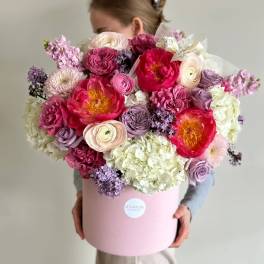 Large pink and lavender bouquet in a round pink box