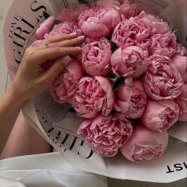 Pink peony bouquet wrapped in white paper