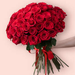 Large bouquet of red roses tied with a red ribbon