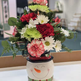 Mixed bouquet in a snowman ceramic container