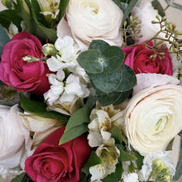 Bouquet of pink and white roses with small white flowers