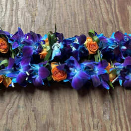 Purple and blue orchid garland with small orange roses