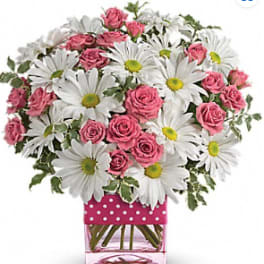 Pink roses and white daisies in a pink polka-dot vase