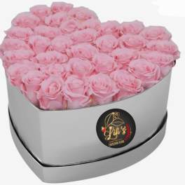 Heart-shaped box filled with pink roses