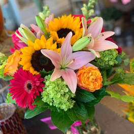 Bouquet with sunflowers, pink lilies, and orange roses
