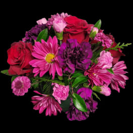 Bouquet of red roses, purple carnations, and pink flowers