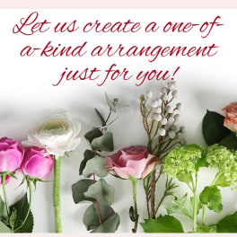 Assorted roses and greenery arranged beneath red script text.