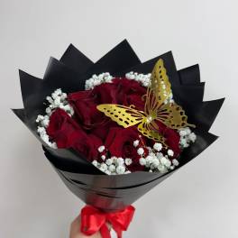 Bouquet of red roses with white baby's breath and a gold butterfly accent
