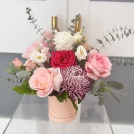Pink and white bouquet in a blush cylindrical box