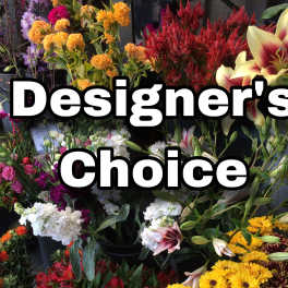 Flower shop display with mixed bouquets and large "Designer’s Choice" text