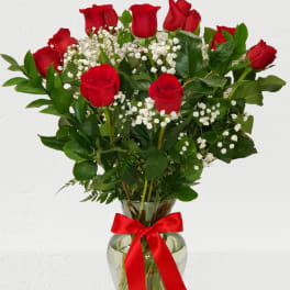 Dozen Red Rose's in a vase with baby breath