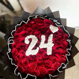 Bouquet of red roses with white "24" decoration and black wrap