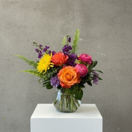 Colorful mixed bouquet in a clear glass vase