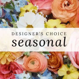 Designer’s choice seasonal bouquet with mixed colorful flowers