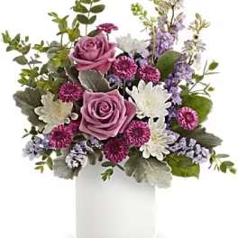 Lavender roses and white daisies in a white vase
