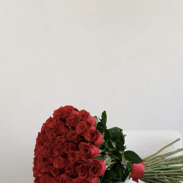Large bouquet of red roses with green leaves