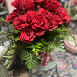 Bouquet of red roses with fern foliage