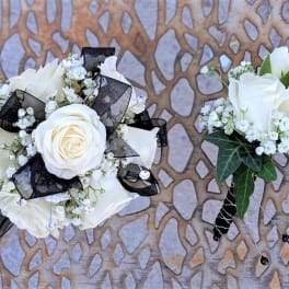 White rose boutonniere and matching wrist corsage with black ribbon