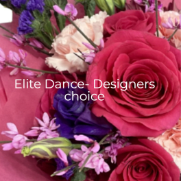 Mixed bouquet of red roses, peach carnations, and purple flowers wrapped in pink paper