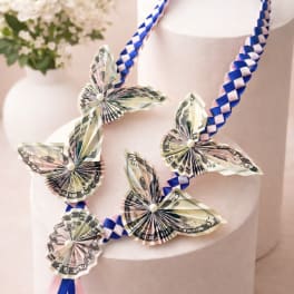 Lei of folded dollar butterflies