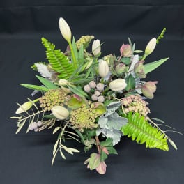 Calming Helebore spring centerpiece with tulips