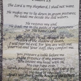A decorative wall hanging with Psalm 23 text over a pastoral scene