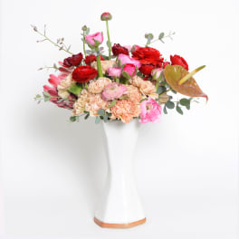 White Inverted Hexagon Vase With Pink and Red Arrangement