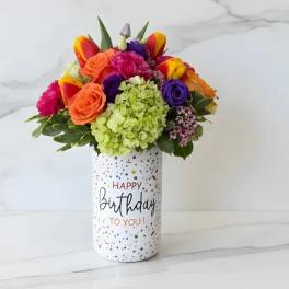 Colorful bouquet in a birthday vase