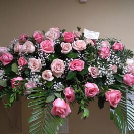 Large pink rose spray with baby's breath and greenery
