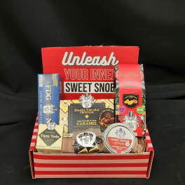Gift box filled with assorted candy and chocolate packages