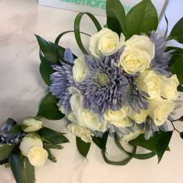 White roses and lavender chrysanthemums with greenery, plus a matching boutonniere