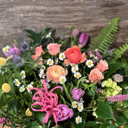 Mixed bouquet with pink, coral, and yellow flowers