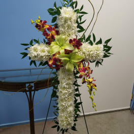 Cross-shaped floral standing spray with white chrysanthemums and green orchids