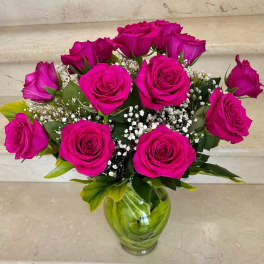 12 Roses Hot Pink arranged in a vase