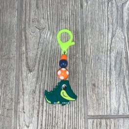 Small crocodile charm with colorful beads on a clip