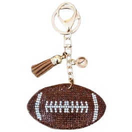 Football-shaped rhinestone keychain with a tassel charm