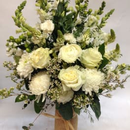 White floral bouquet in a burlap-wrapped vase