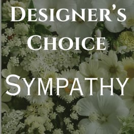 White sympathy floral arrangement with large blooms and filler flowers