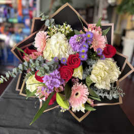 Bouquet of red roses, pink gerberas, and white hydrangeas