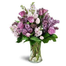 Pink and lavender bouquet in a clear glass vase