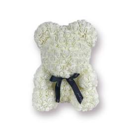 White rose teddy bear with a dark ribbon bow