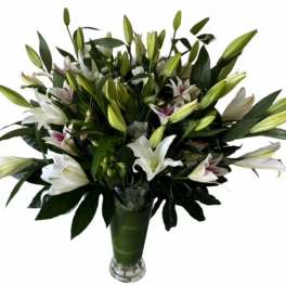 Bouquet of white lilies in a glass vase