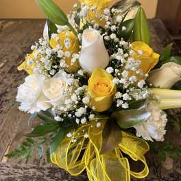 Yellow and white rose bouquet with baby's breath and lilies