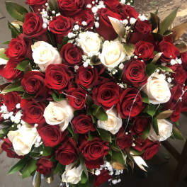 Bouquet of red and white roses with baby's breath